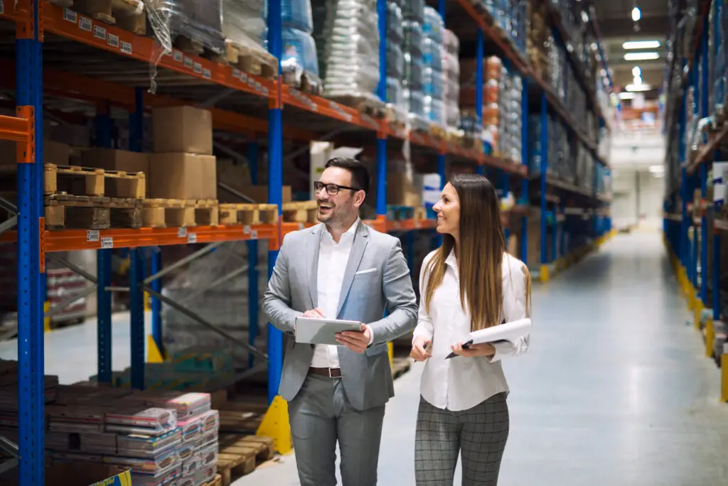 warehouse workers talking about logistics and distribution.